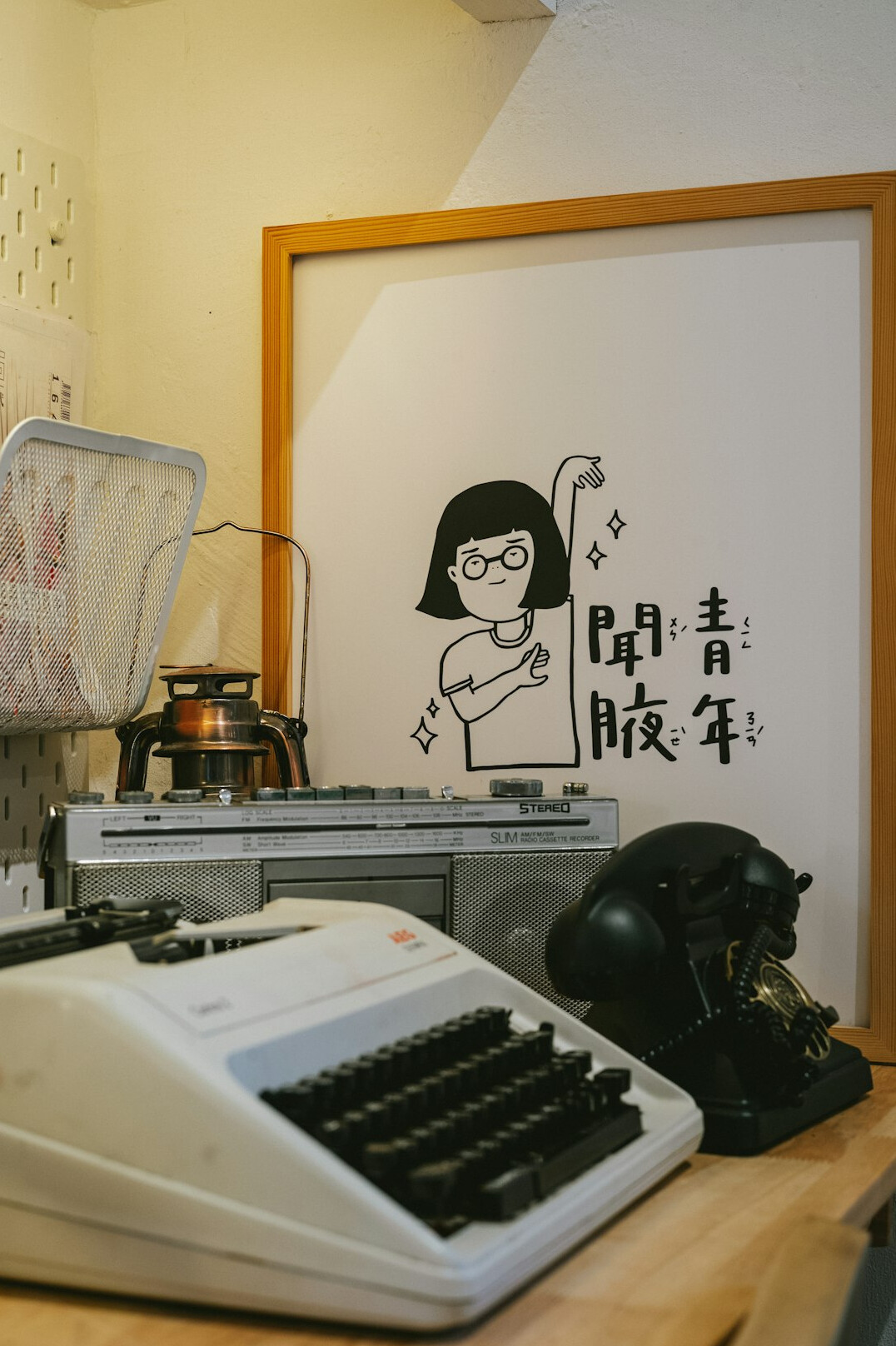 Retro advertising agency office with a poster board and typewriter